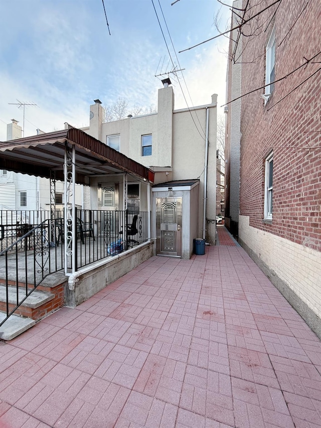 view of patio / terrace featuring a gate