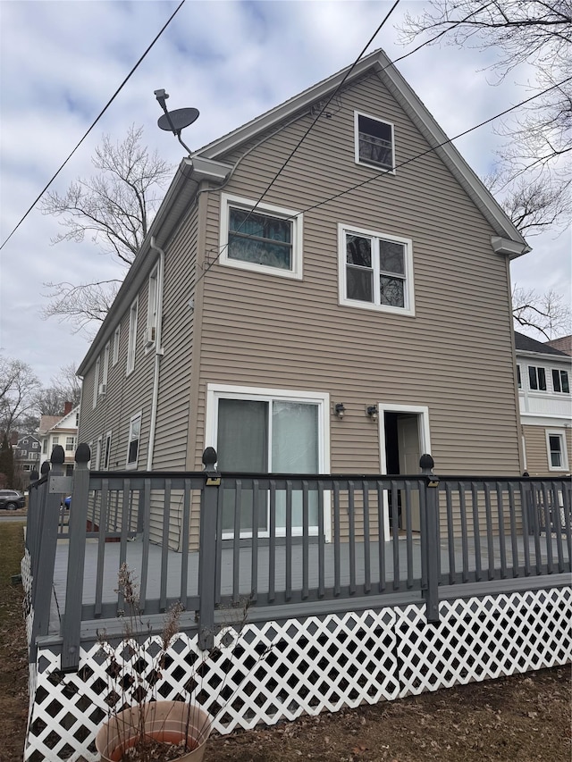 rear view of property with a wooden deck