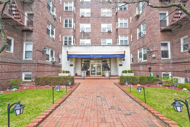 view of building exterior with cooling unit