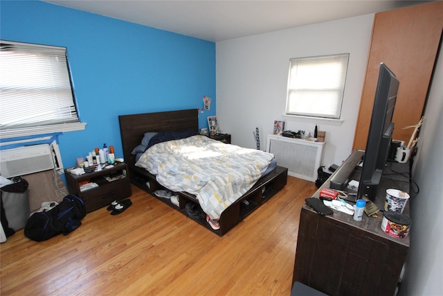 bedroom with wood finished floors