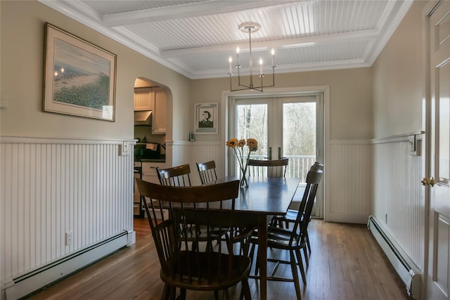 dining area with arched walkways, baseboard heating, beam ceiling, and wood-type flooring