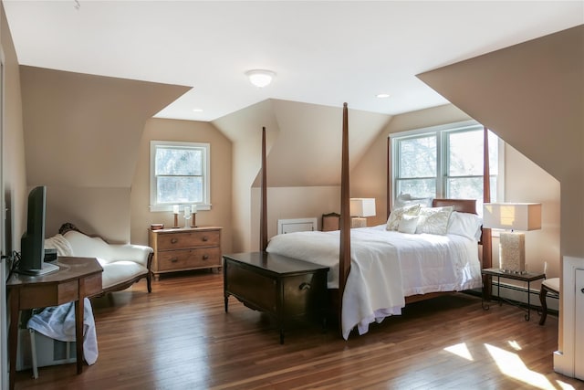 bedroom featuring a baseboard heating unit, vaulted ceiling, recessed lighting, and wood finished floors