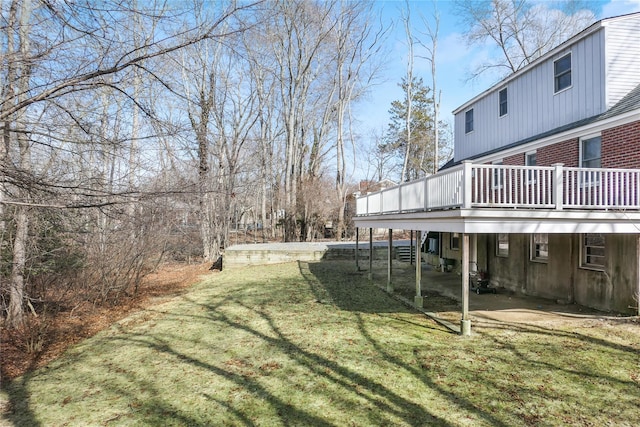 view of yard featuring a patio and a deck