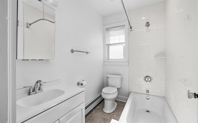 bathroom featuring vanity, baseboards,  shower combination, toilet, and baseboard heating