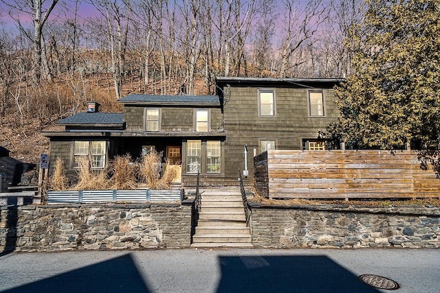 view of front of property with fence