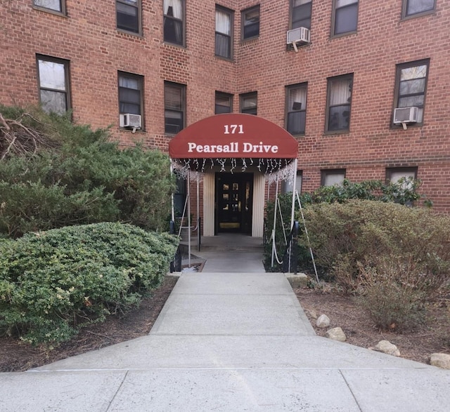 view of building exterior with cooling unit