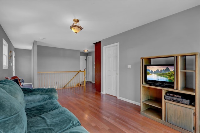 living room featuring wood finished floors and baseboards