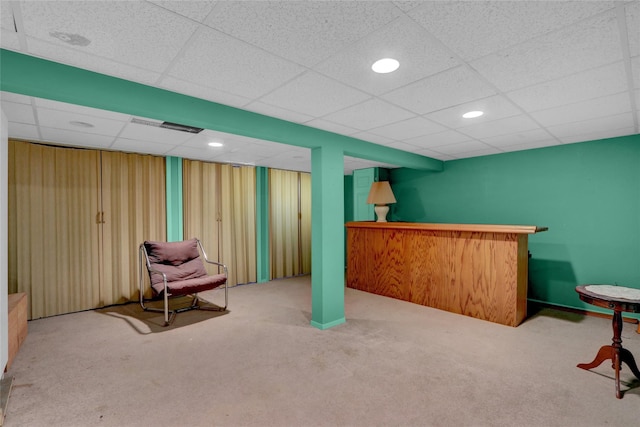 interior space featuring carpet flooring, recessed lighting, visible vents, and a drop ceiling