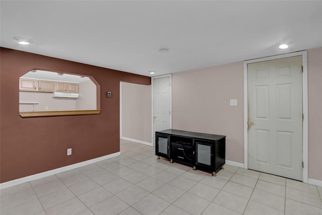 spare room with light tile patterned floors, baseboards, and recessed lighting