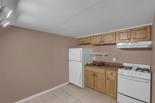 kitchen with under cabinet range hood, a sink, dark countertops, white appliances, and light tile patterned floors