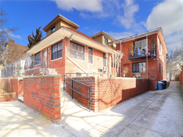 view of front of home featuring brick siding