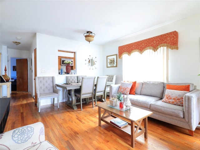 living area with hardwood / wood-style floors