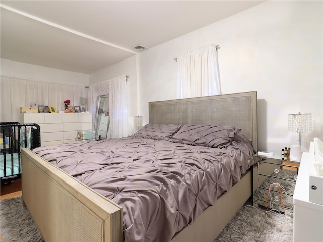 bedroom featuring visible vents