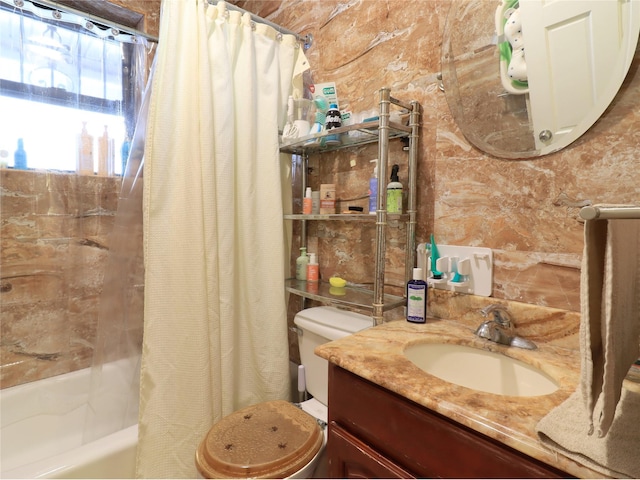 full bath with vanity, toilet, and shower / bath combo with shower curtain