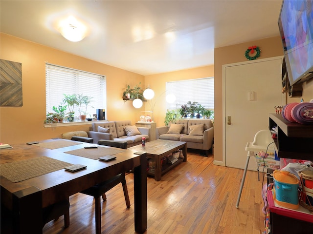 dining area featuring light wood-type flooring