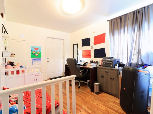 bedroom with light wood-type flooring