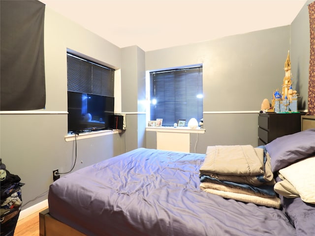 bedroom with wood finished floors