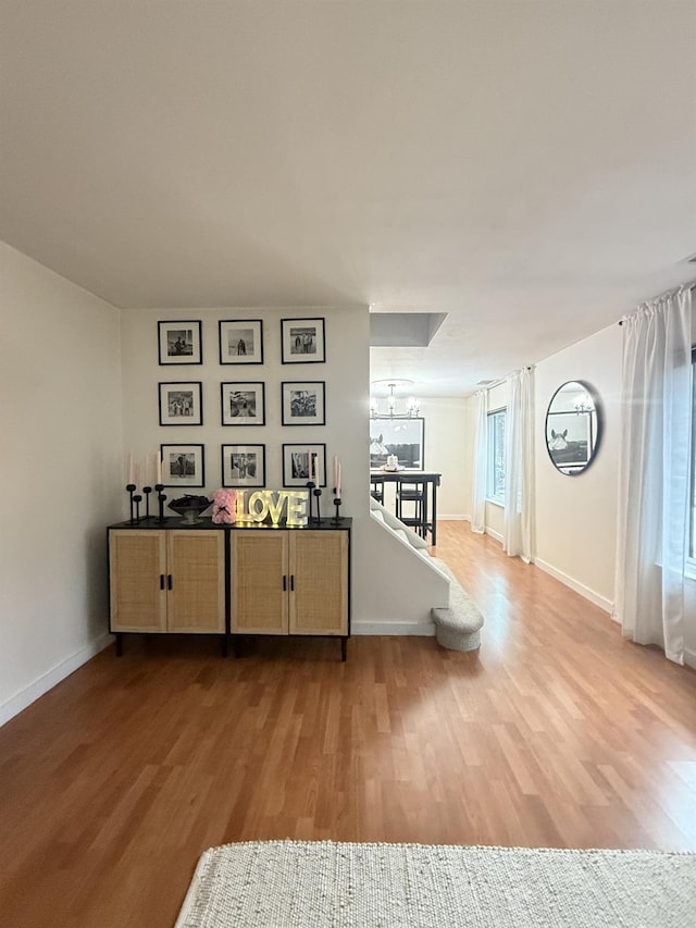 game room featuring wood finished floors and baseboards