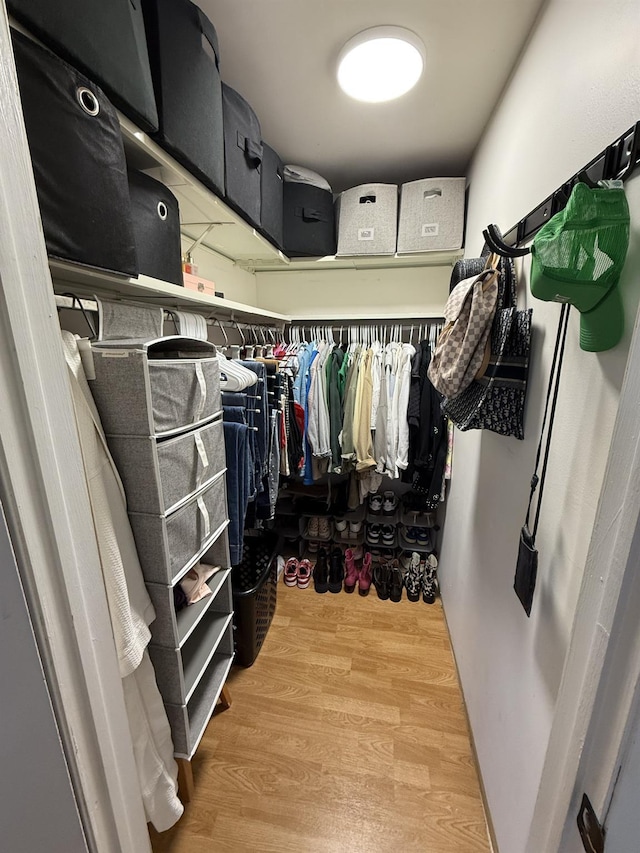 spacious closet with wood finished floors