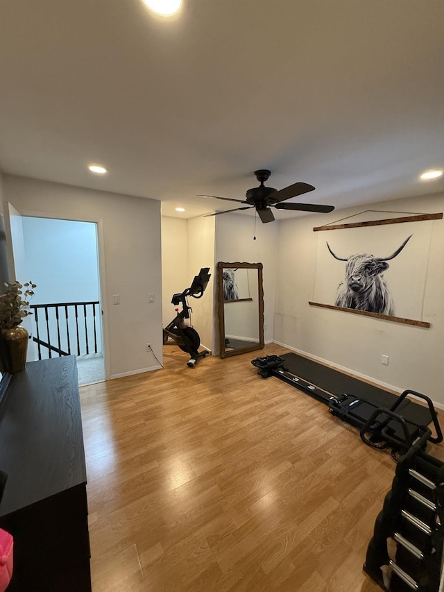 exercise area with recessed lighting, baseboards, light wood finished floors, and ceiling fan