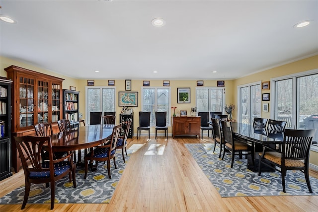 dining area with recessed lighting, a healthy amount of sunlight, and light wood-style flooring