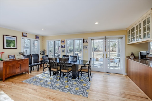 dining space with recessed lighting, french doors, light wood-style floors, and visible vents