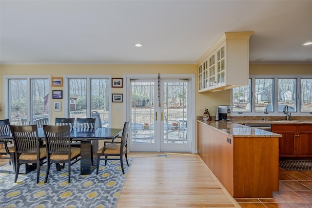 dining space featuring recessed lighting, wood finished floors, and ornamental molding