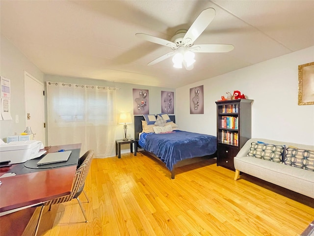 bedroom featuring a ceiling fan and light wood finished floors