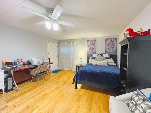 bedroom with ceiling fan and wood finished floors