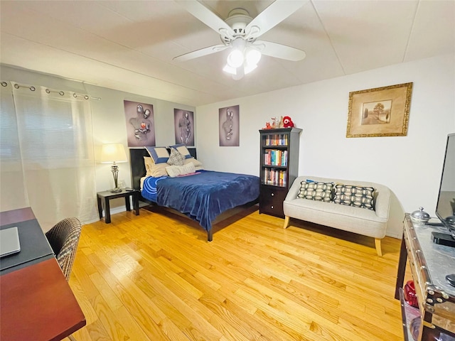 bedroom with a ceiling fan and light wood-type flooring