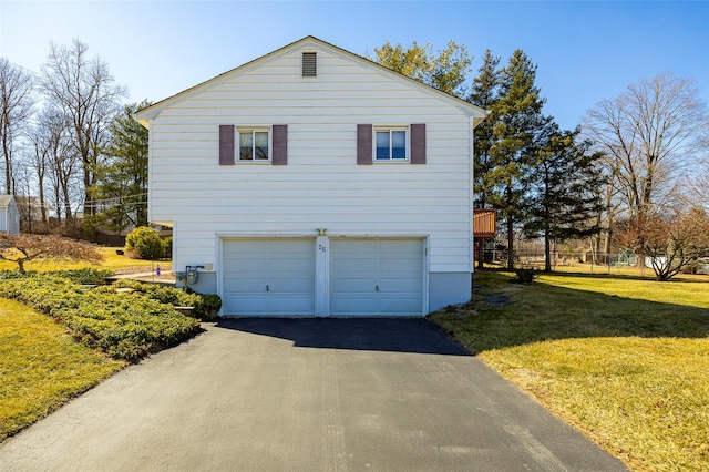 view of property exterior with aphalt driveway, an attached garage, and a lawn