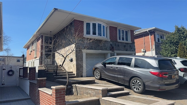 view of front facade with driveway and a garage