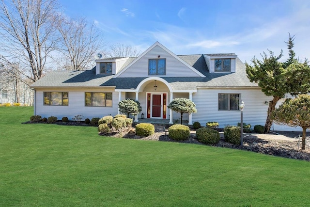 view of front of home featuring roof with shingles and a front lawn