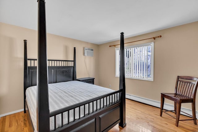 1380 Jackson Lndg, Mattituck, NY 11952 - bedroom featuring light wood-style flooring, baseboards, and a wall mounted air conditioner