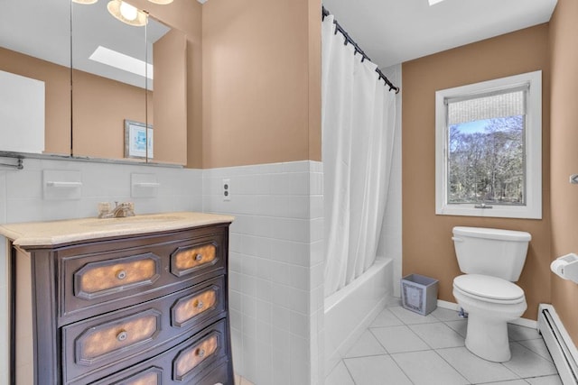 1380 Jackson Lndg, Mattituck, NY 11952 - full bath featuring tile patterned flooring, shower / bath combination with curtain, a baseboard heating unit, tile walls, and toilet