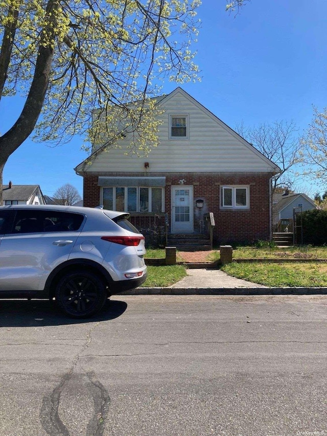 view of front of home with brick siding