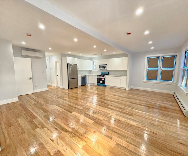 unfurnished living room featuring recessed lighting, a wall mounted AC, light wood-type flooring, and a baseboard heating unit