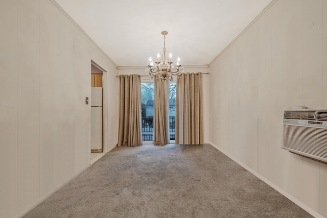 carpeted empty room featuring a wall mounted AC, an inviting chandelier, and ornamental molding