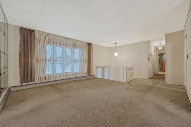 unfurnished room featuring baseboard heating and carpet flooring