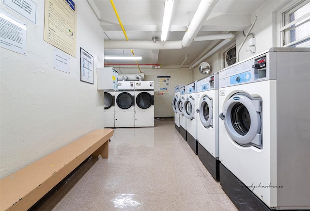 143-25 84th Dr Unit 4F, Briarwood, NY 11435 - shared laundry area with tile patterned floors and separate washer and dryer