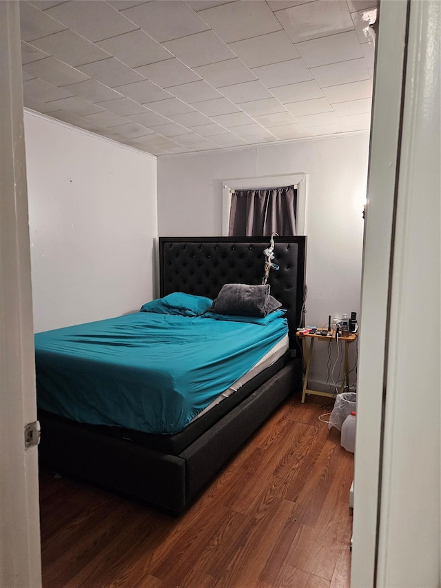 bedroom featuring wood finished floors