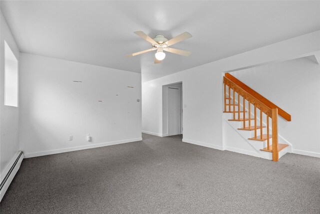unfurnished living room with baseboard heating, a ceiling fan, carpet flooring, stairway, and baseboards