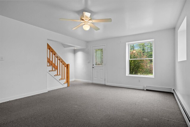 foyer entrance with carpet, stairway, ceiling fan, a baseboard radiator, and baseboard heating