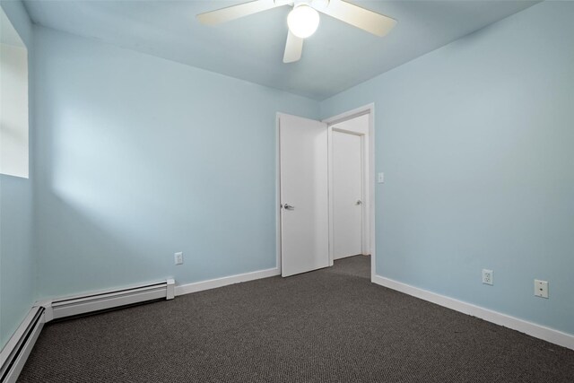 unfurnished room featuring dark carpet, a baseboard radiator, a ceiling fan, and baseboards