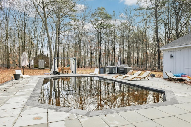 view of swimming pool with a patio area