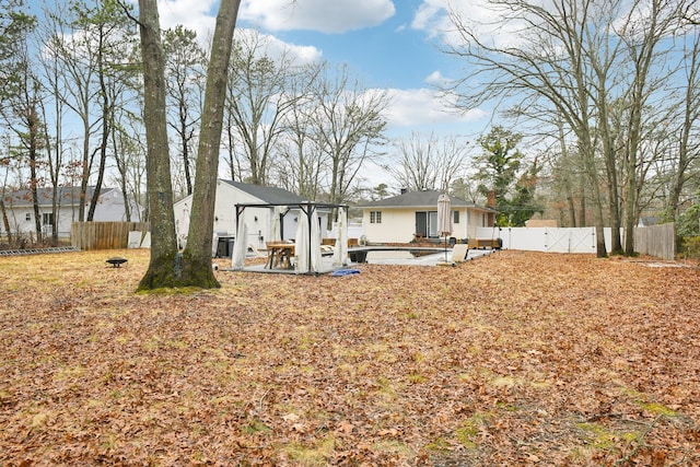 back of house with a patio area, a gate, and a fenced backyard