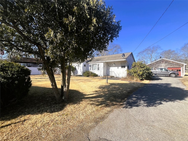 view of front of home featuring an outbuilding