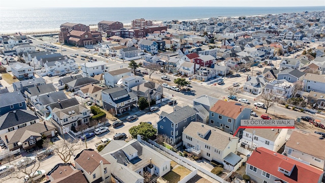 bird's eye view featuring a water view and a residential view