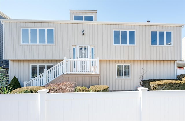 view of front of property featuring fence