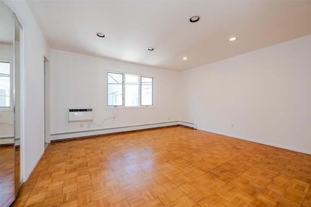 unfurnished room with a wealth of natural light, a wall mounted air conditioner, recessed lighting, and baseboard heating